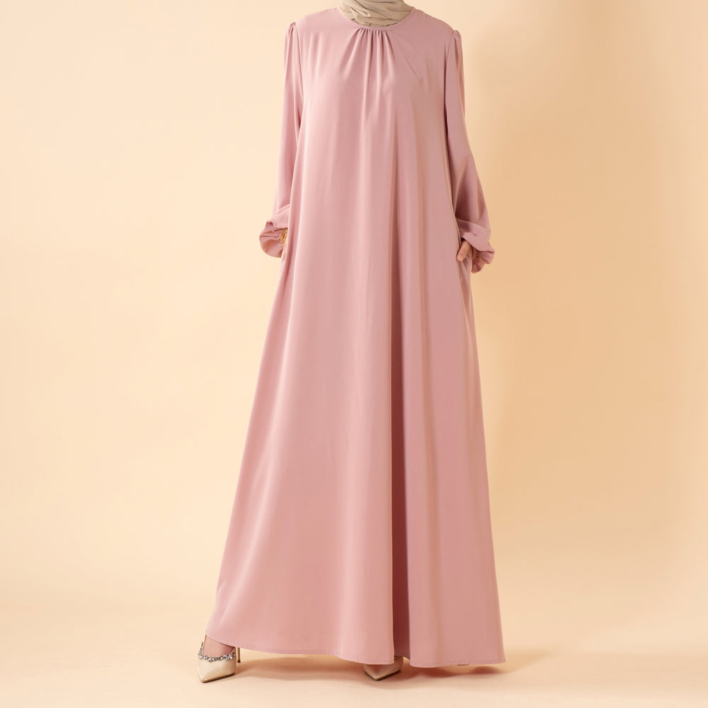 Candy color abaya in coral — vibrant pastel full-length modest dress