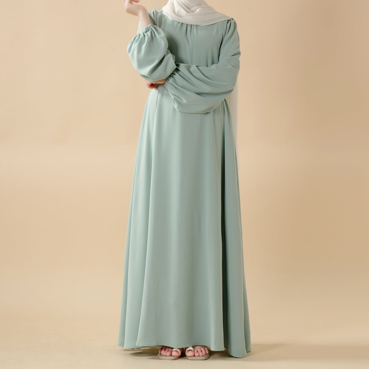 Candy color abaya in mint green — flowy silhouette with gathered shoulders