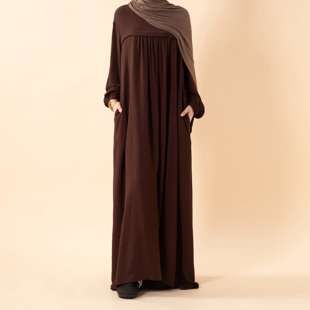 Side view showing loose modest silhouette of Hajj abaya