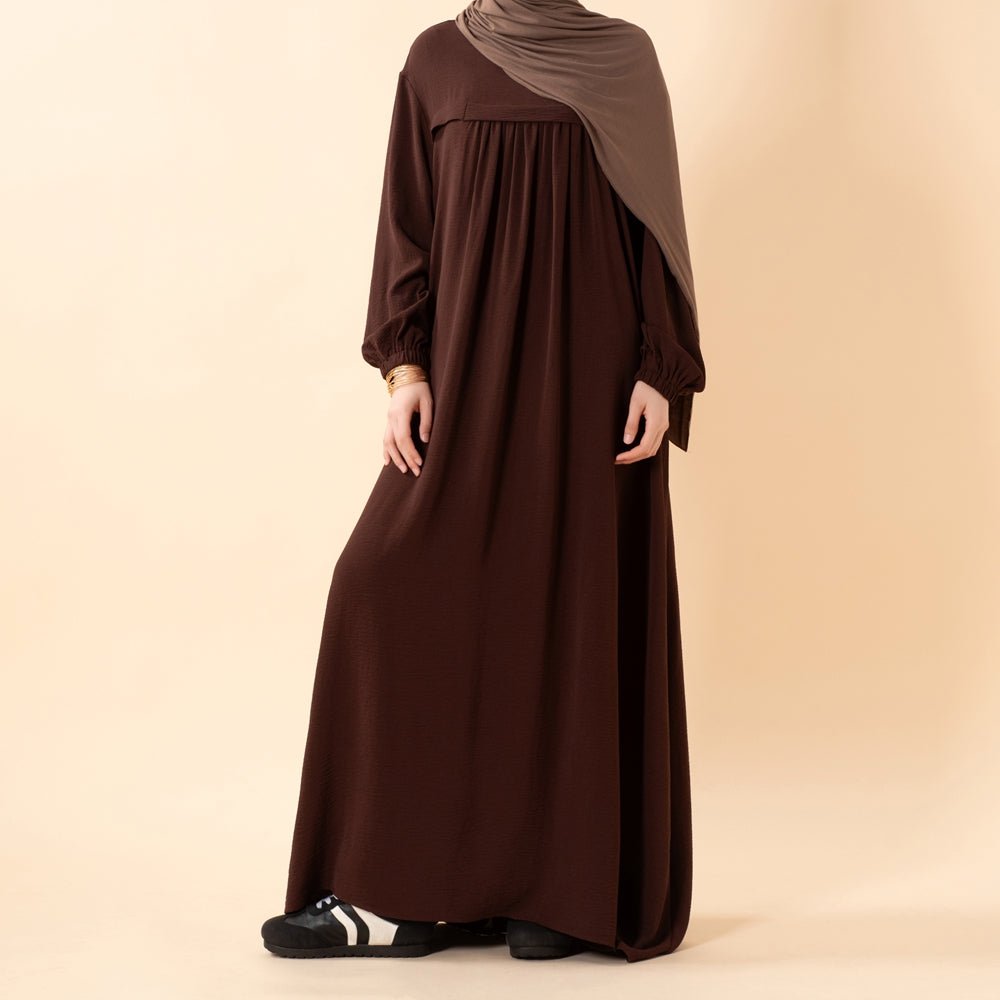Close-up of soft crepe fabric drape on modest abaya