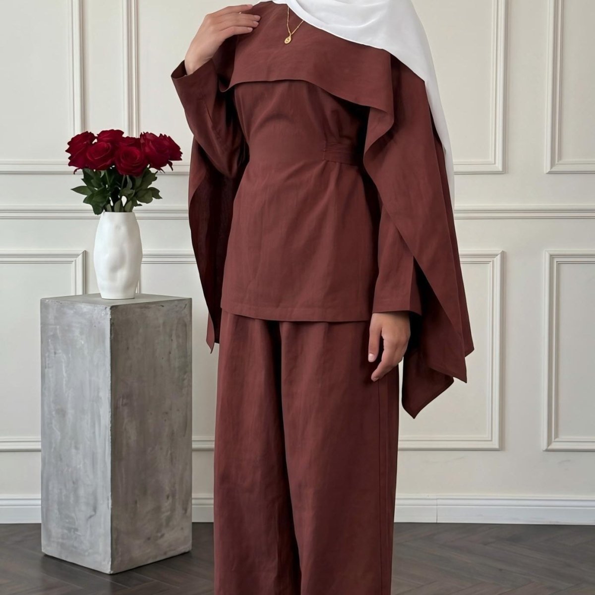 Back view showing self-tie detail and full square shawl coverage