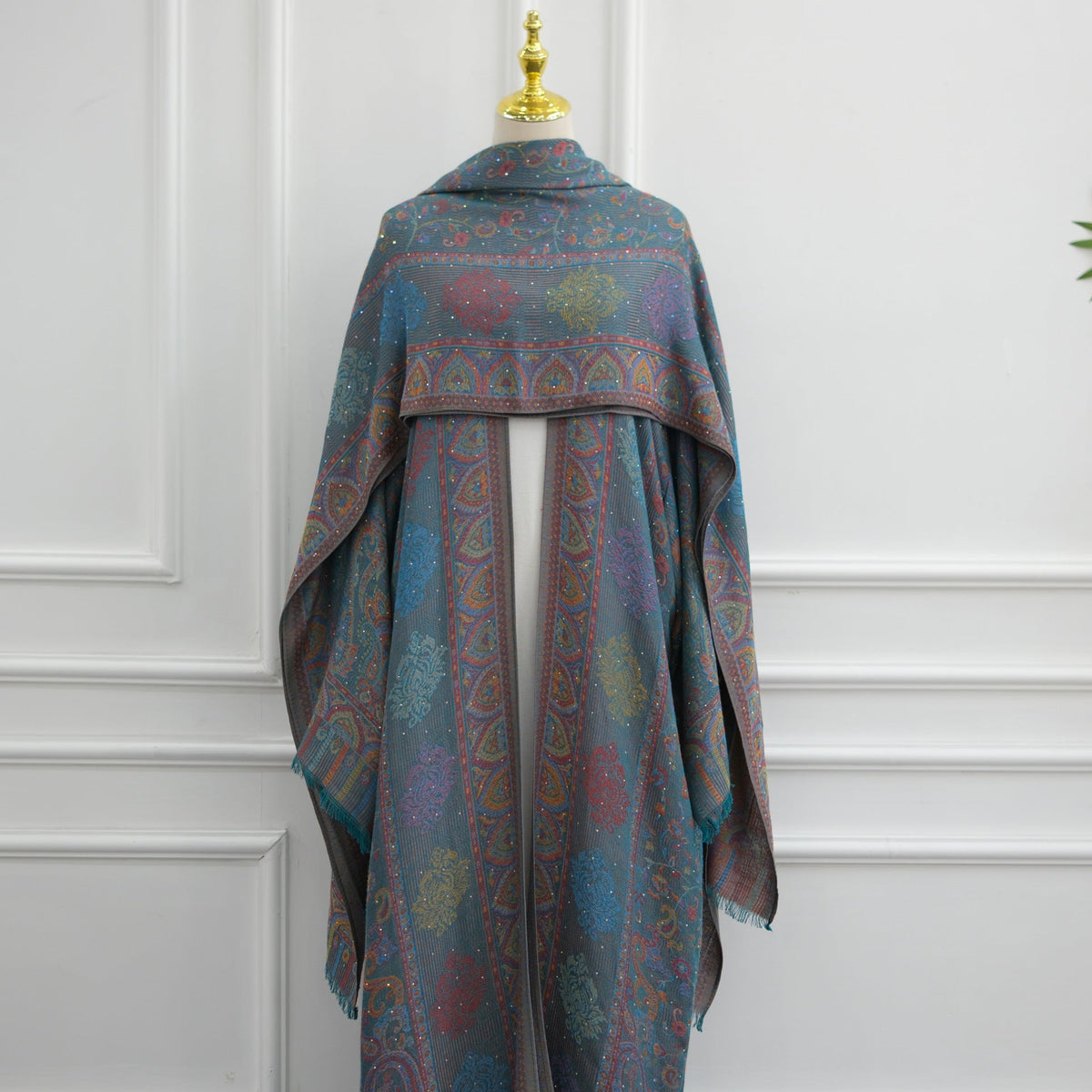 Angled view of jacquard rhinestone open abaya silhouette