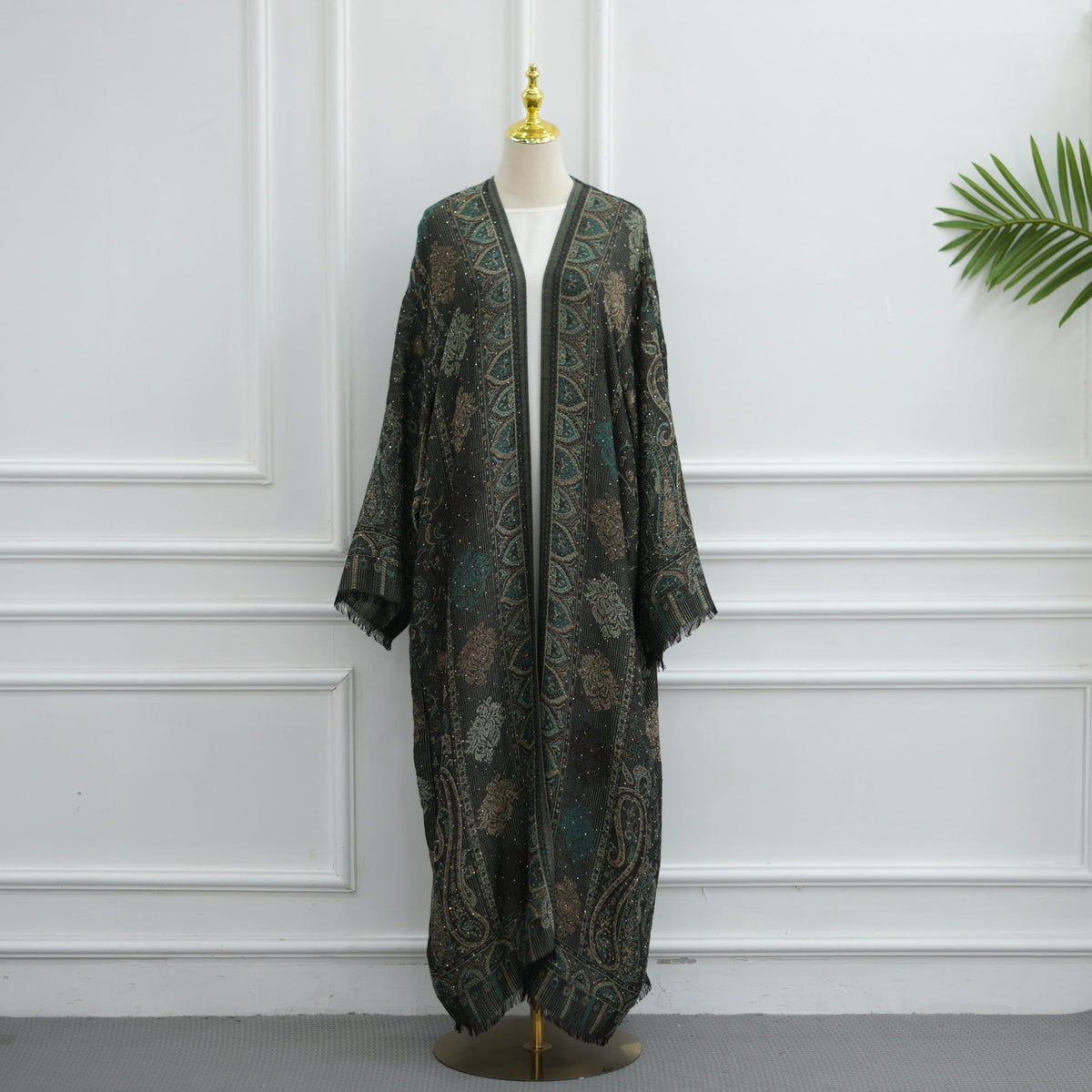 Open cardigan abaya layered over inner dress