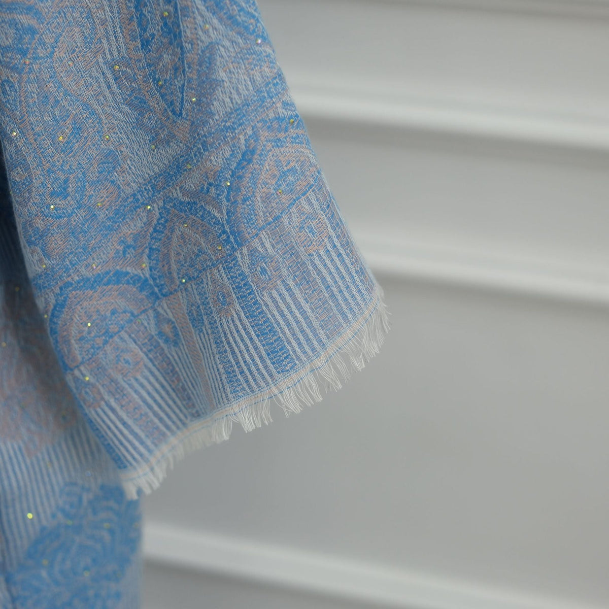 Close-up of hot-fix rhinestone embellishment on jacquard fabric