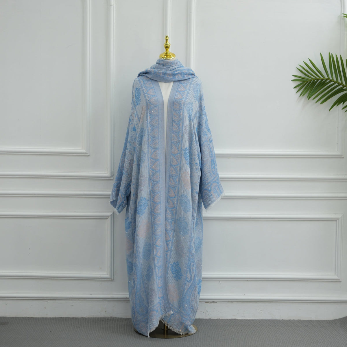 Side view of open-front jacquard cardigan abaya with rhinestone trim