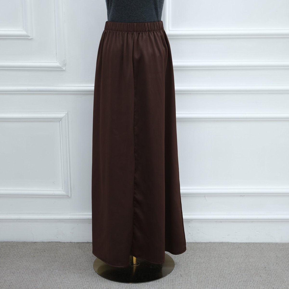 Model wearing lace trim satin top in motion showcasing bell sleeve drape