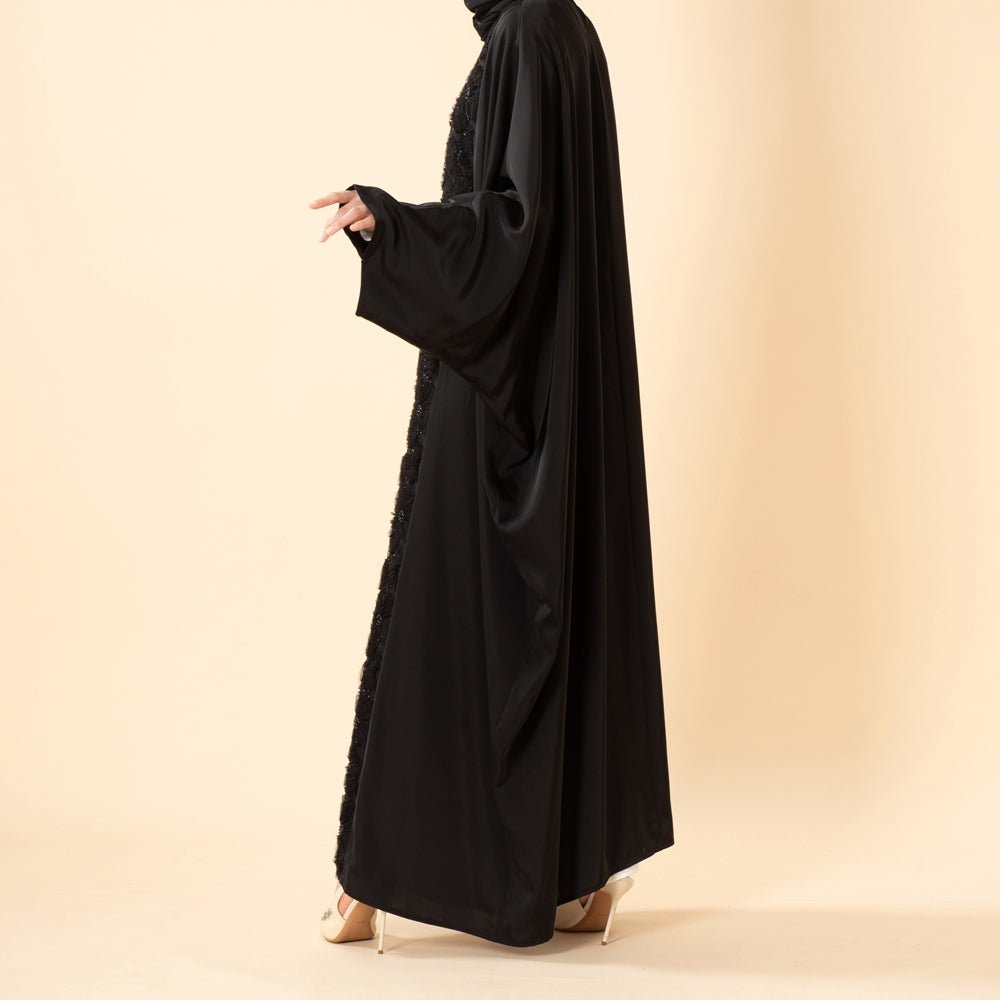 Back view of satin batwing abaya with flowing full-length silhouette