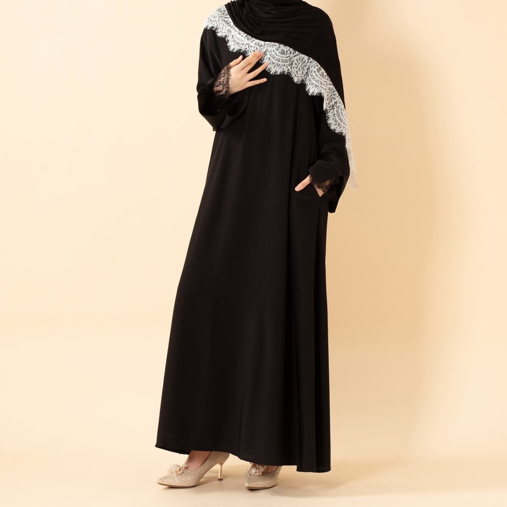 Close-up of delicate eyelash lace cuff detail on Nida abaya sleeve