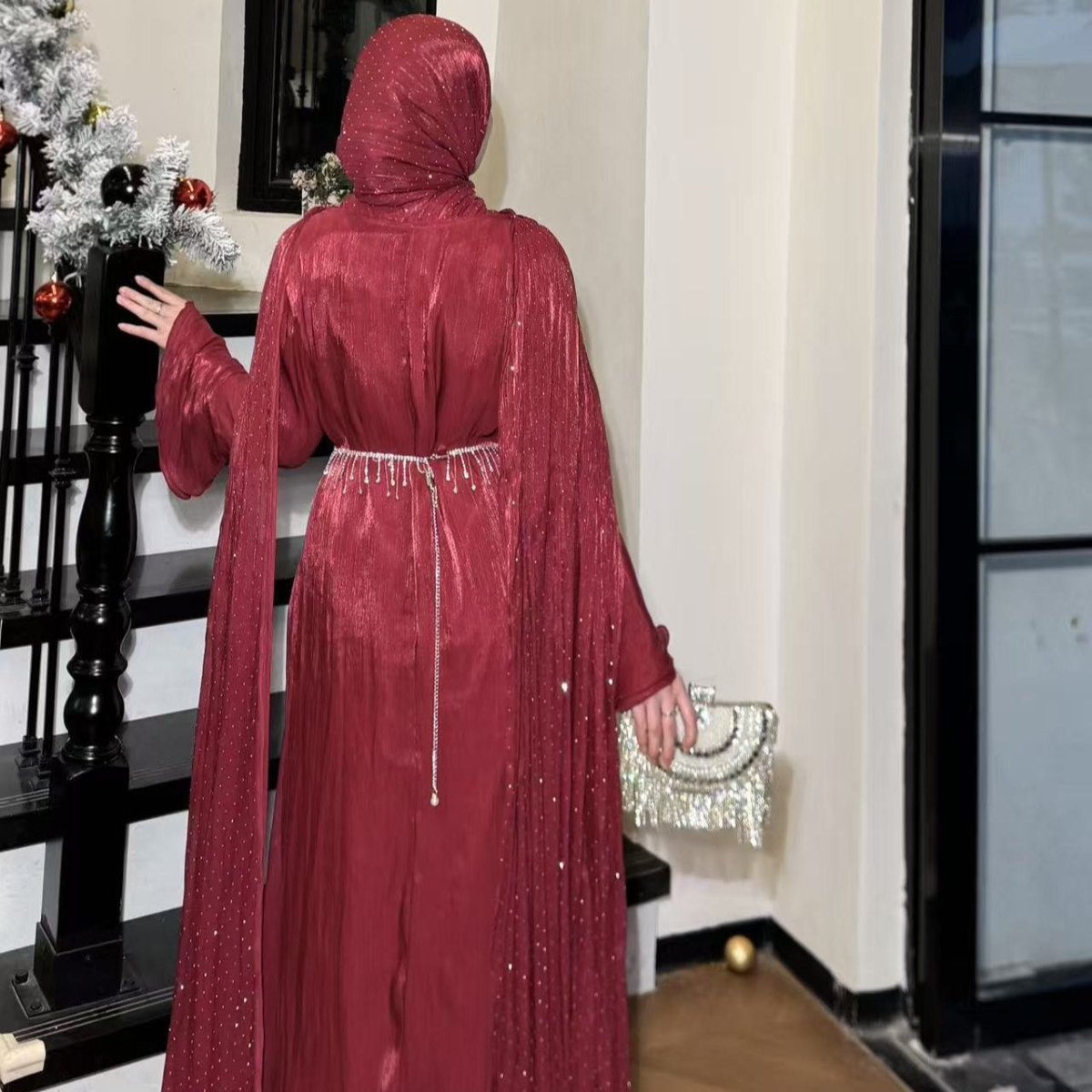 Back view of pleated cape abaya showing flowing panel drape and A-line skirt