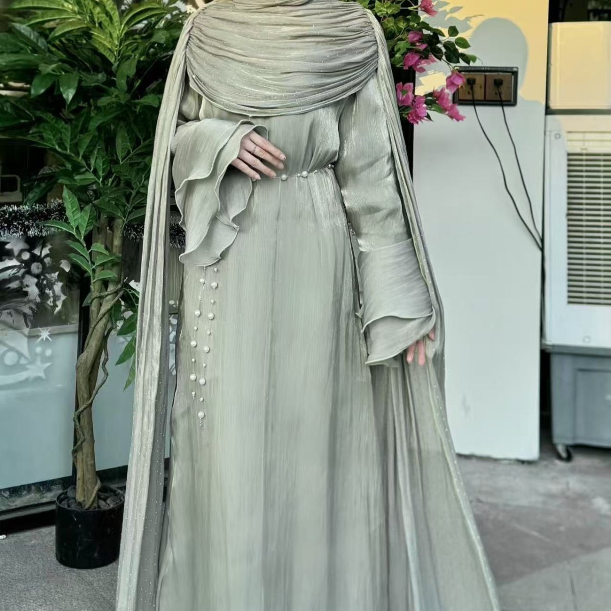 Side view of cape sleeve abaya in third colourway showing silhouette flow