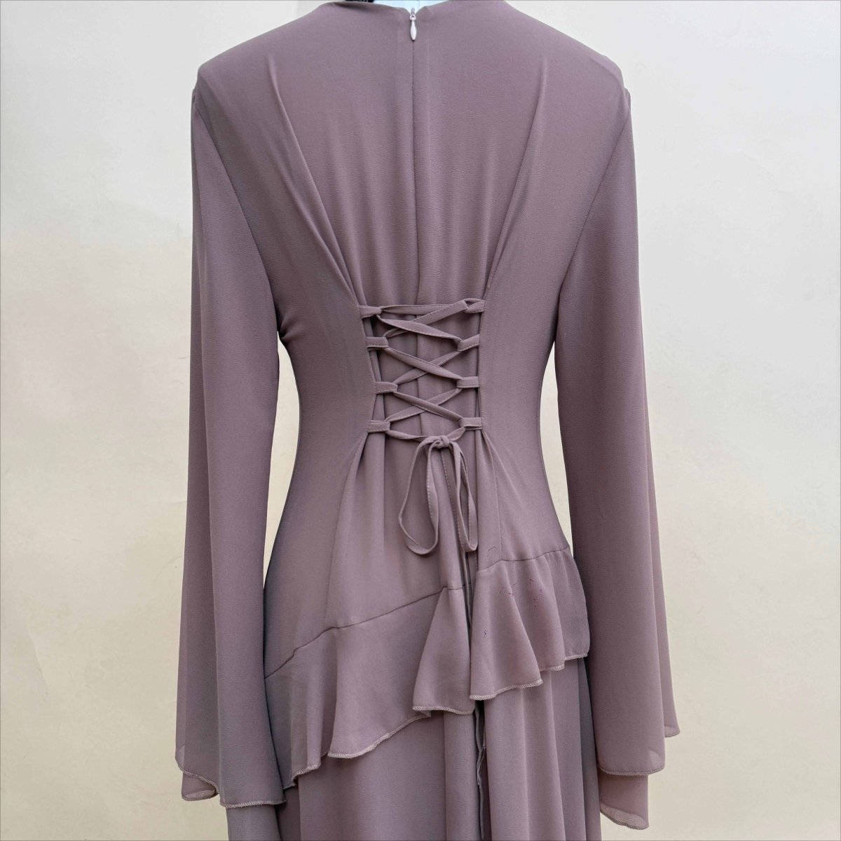 Overhead flat lay of chiffon ruffle gown in sky blue and burgundy colourways