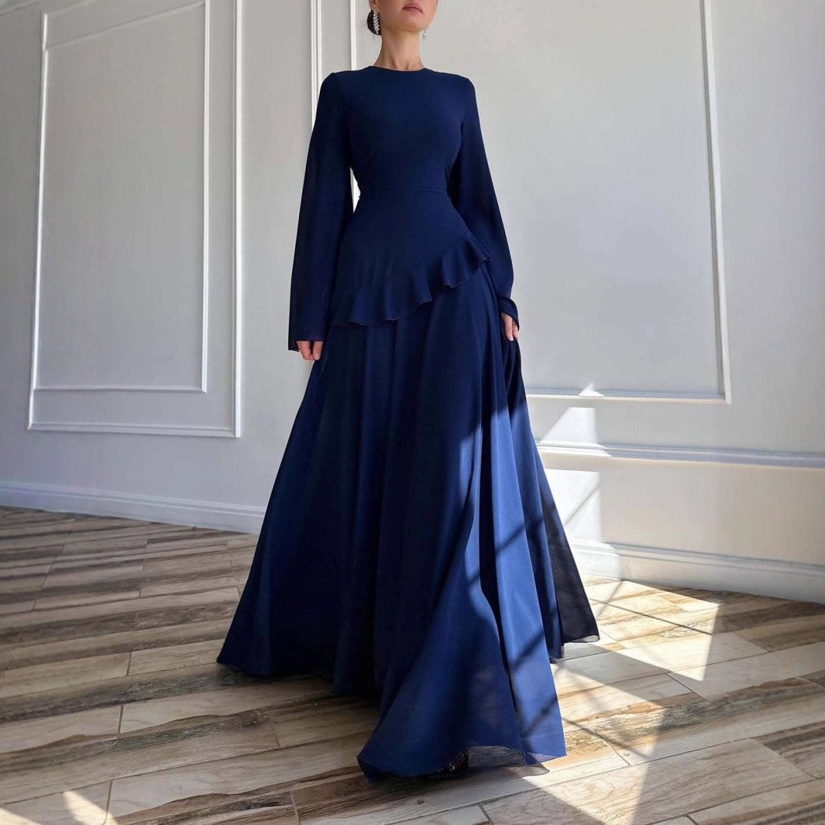 Sky blue chiffon ruffle gown showing full-length silhouette and movement