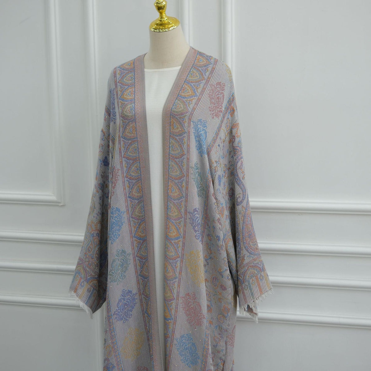 Flowing cardigan abaya showcasing jacquard texture