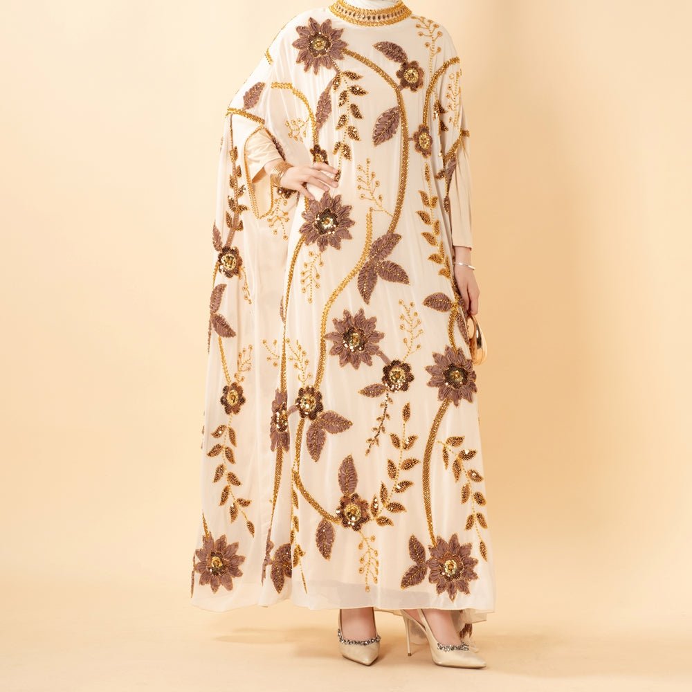 Close-up of dimensional floral bead embroidery on abaya bodice