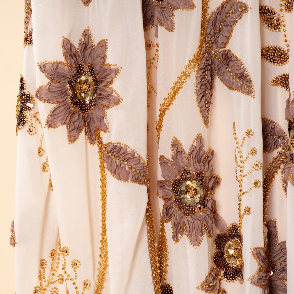 Stretch inner dress detail underneath embroidered floral outer abaya