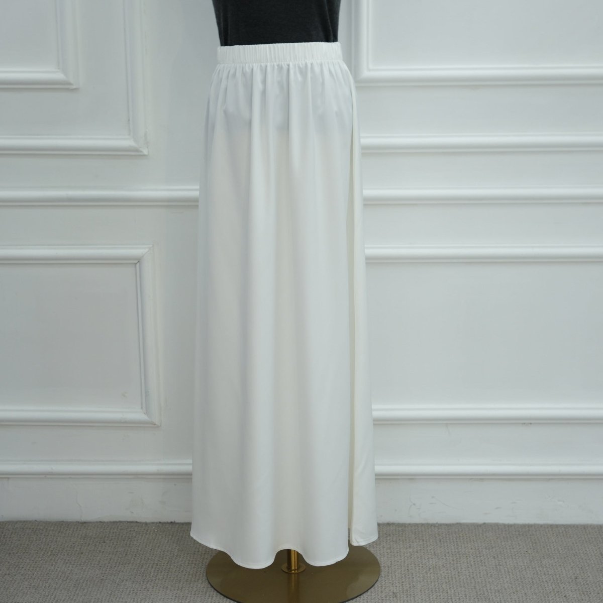 Editorial back view of contrast lace panel satin top