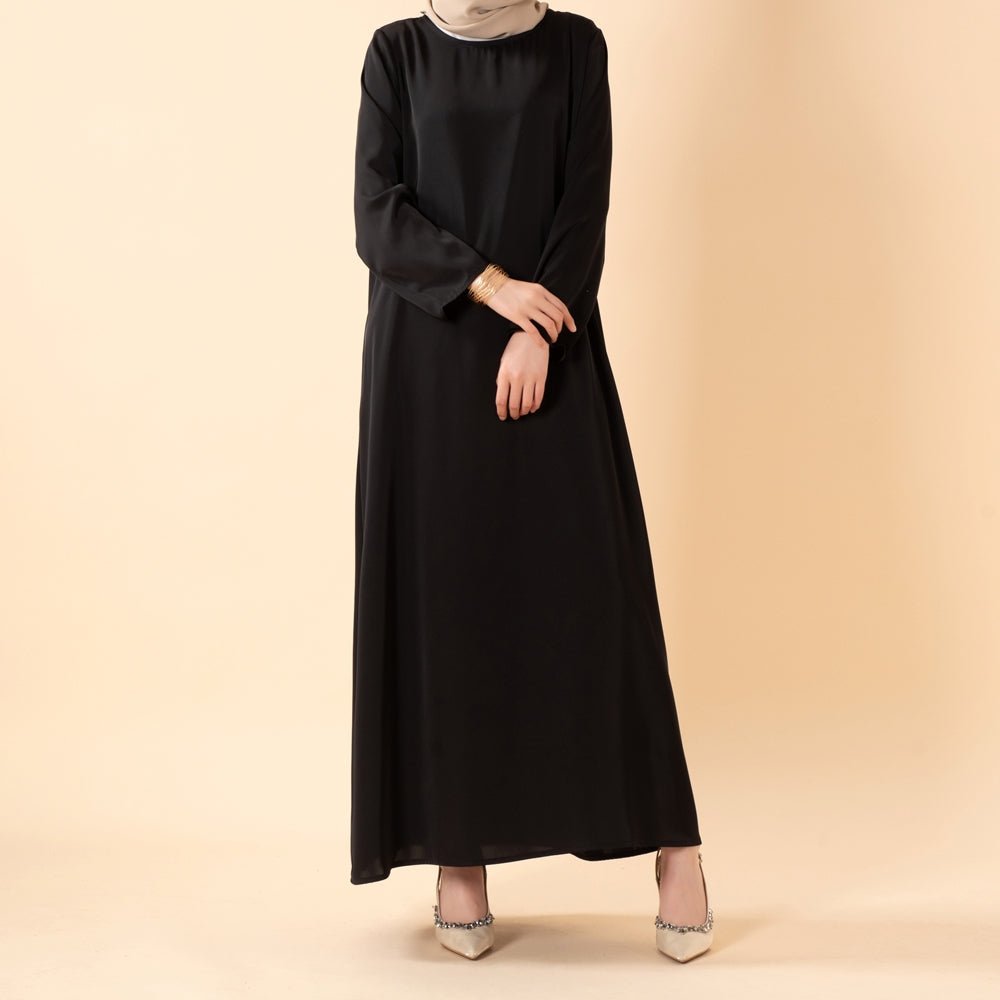 Full-length view of satin inner dress showing smooth fabric drape