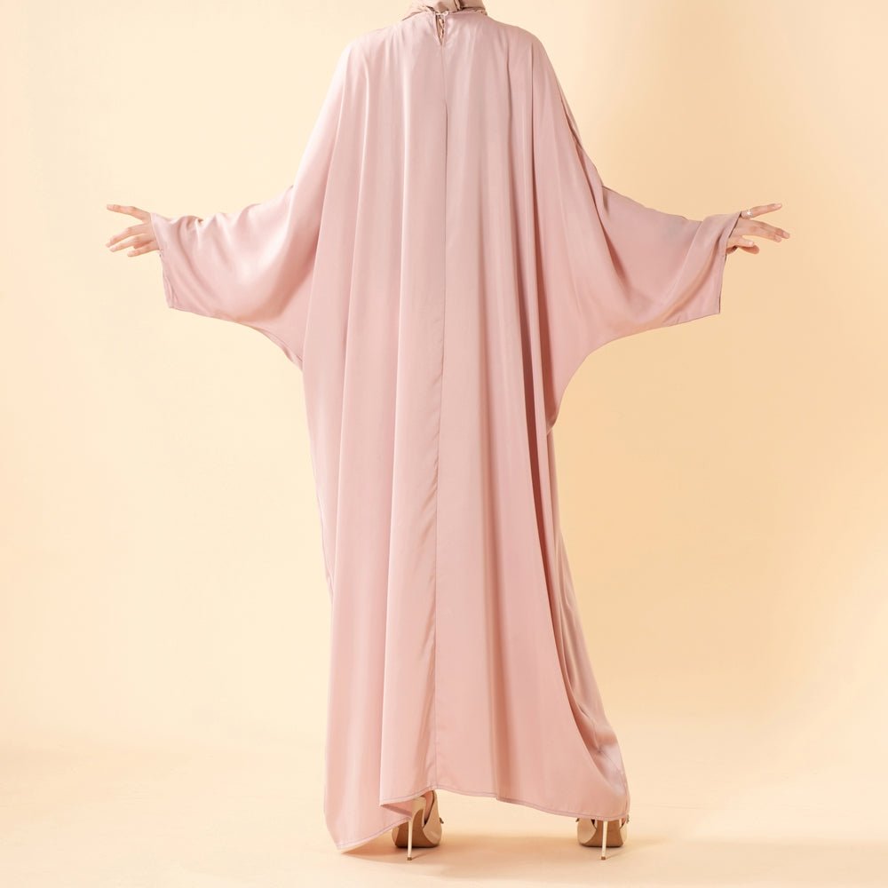 Flowing batwing silhouette of luxury satin abaya in full length