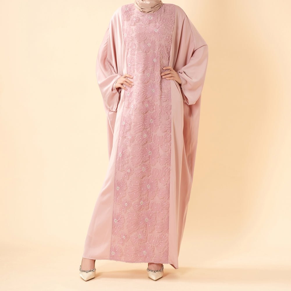 Close-up of dimensional 3D ribbon embroidery and bead texture on satin abaya