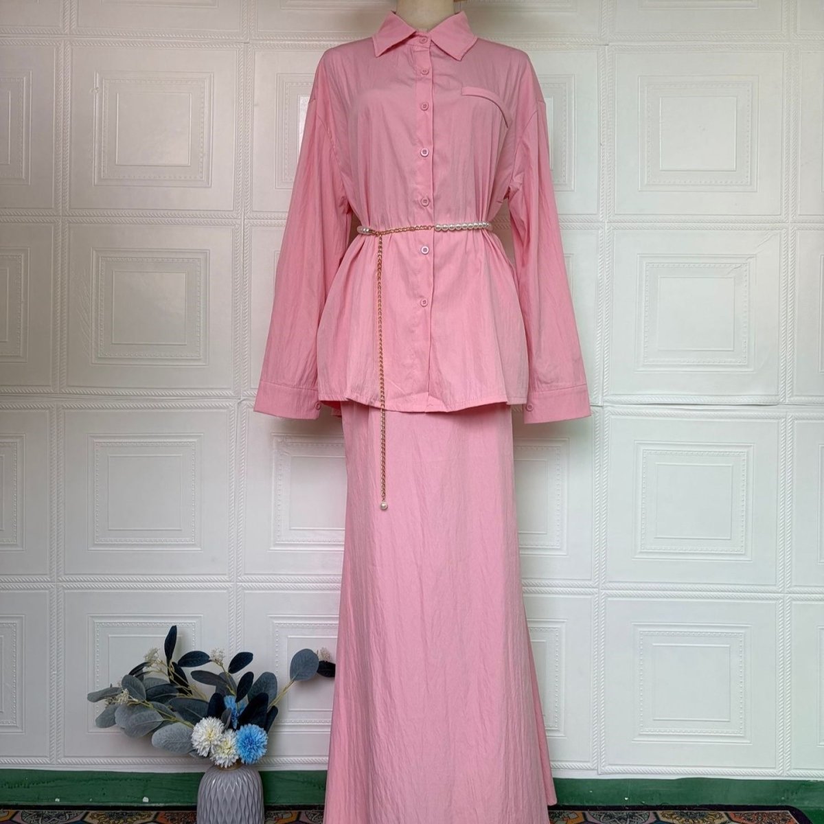 Side view of smooth fitted maxi skirt with ruffle hem border