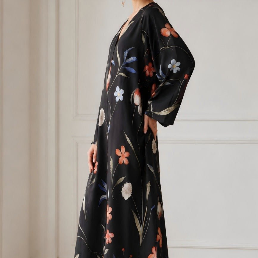 Wide flared sleeve detail of open front botanical print abaya