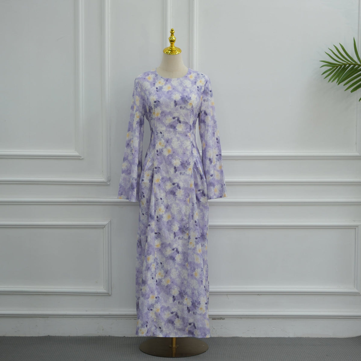 Styled look pairing watercolour floral maxi dress with sage green hijab